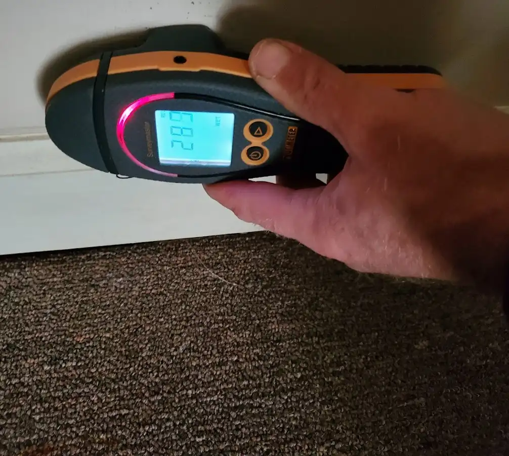 Moisture detection at baseboard during Storm Damage Restoration in Souderton